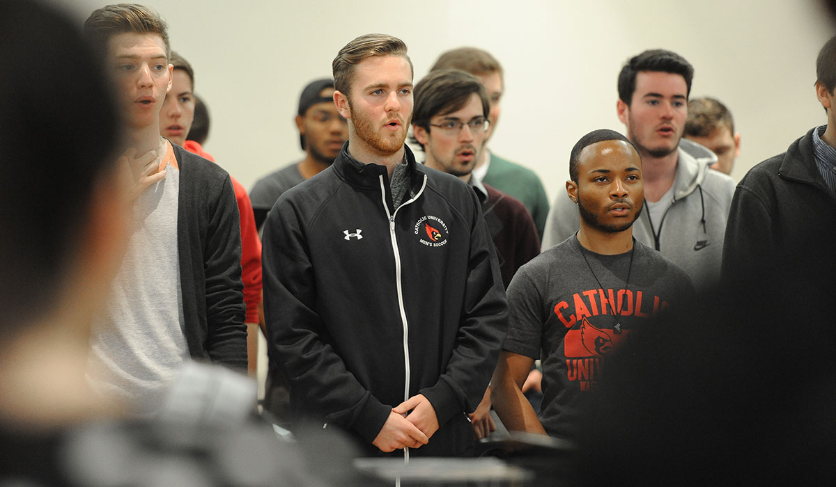 Male students singing