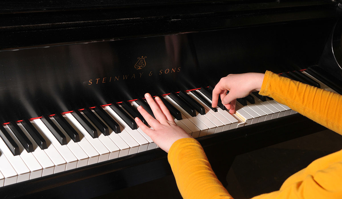 Student playing piano