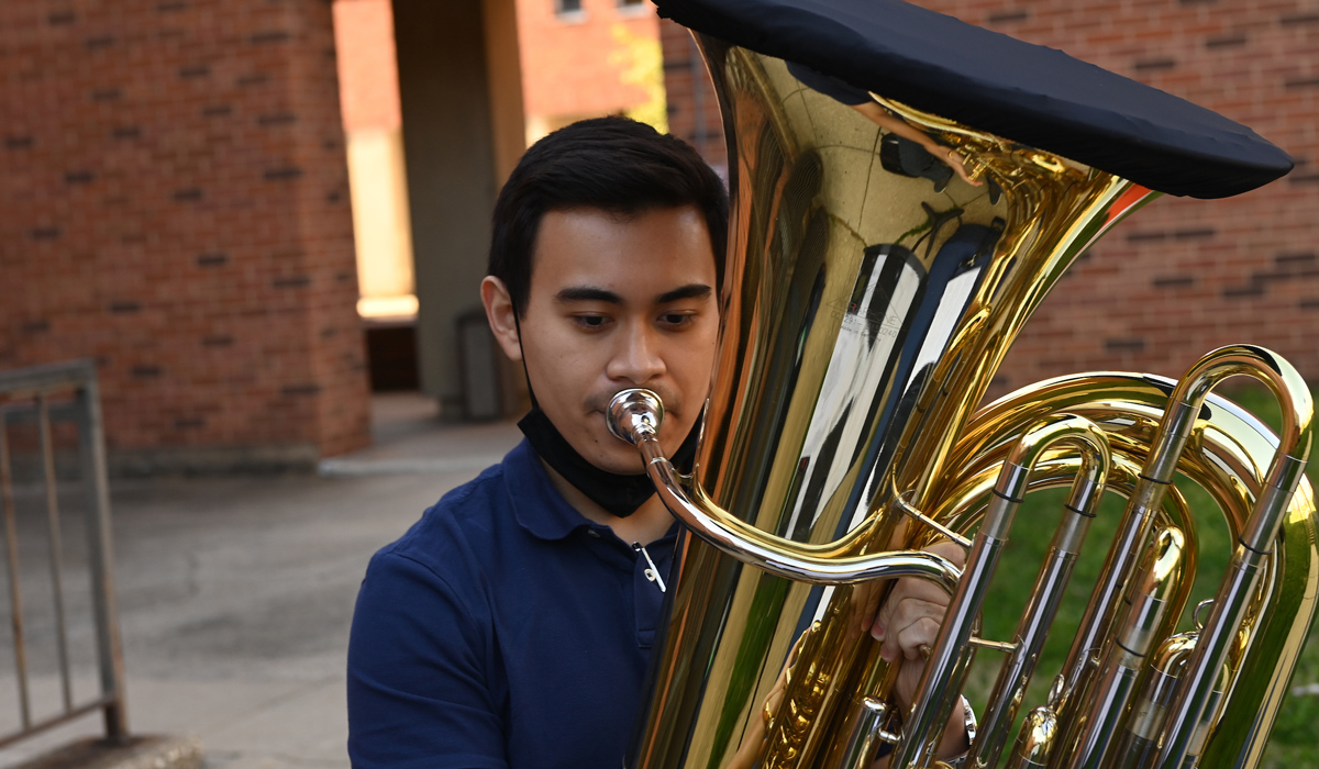 student playing tuba